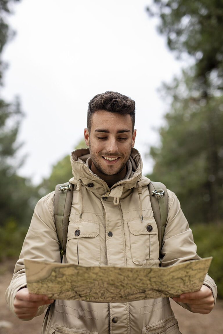 medium shot smiley guy holding map
